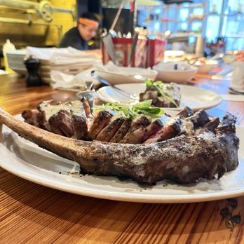 Red Ash Italia signature dishes Bone-in RibeyeProsciutto-Wrapped FontinaRed Ash Lasagna
